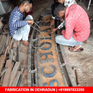 Letters of MS 2mm being welded on Arch