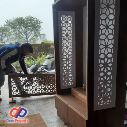 Carpenter is working on Mandir Doors.