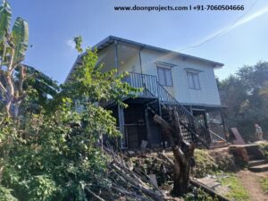 Designed for Chamoli ji, Double Storey Prefab House in Neelkanth. All the windows have rain guards and metal staircase to go up.