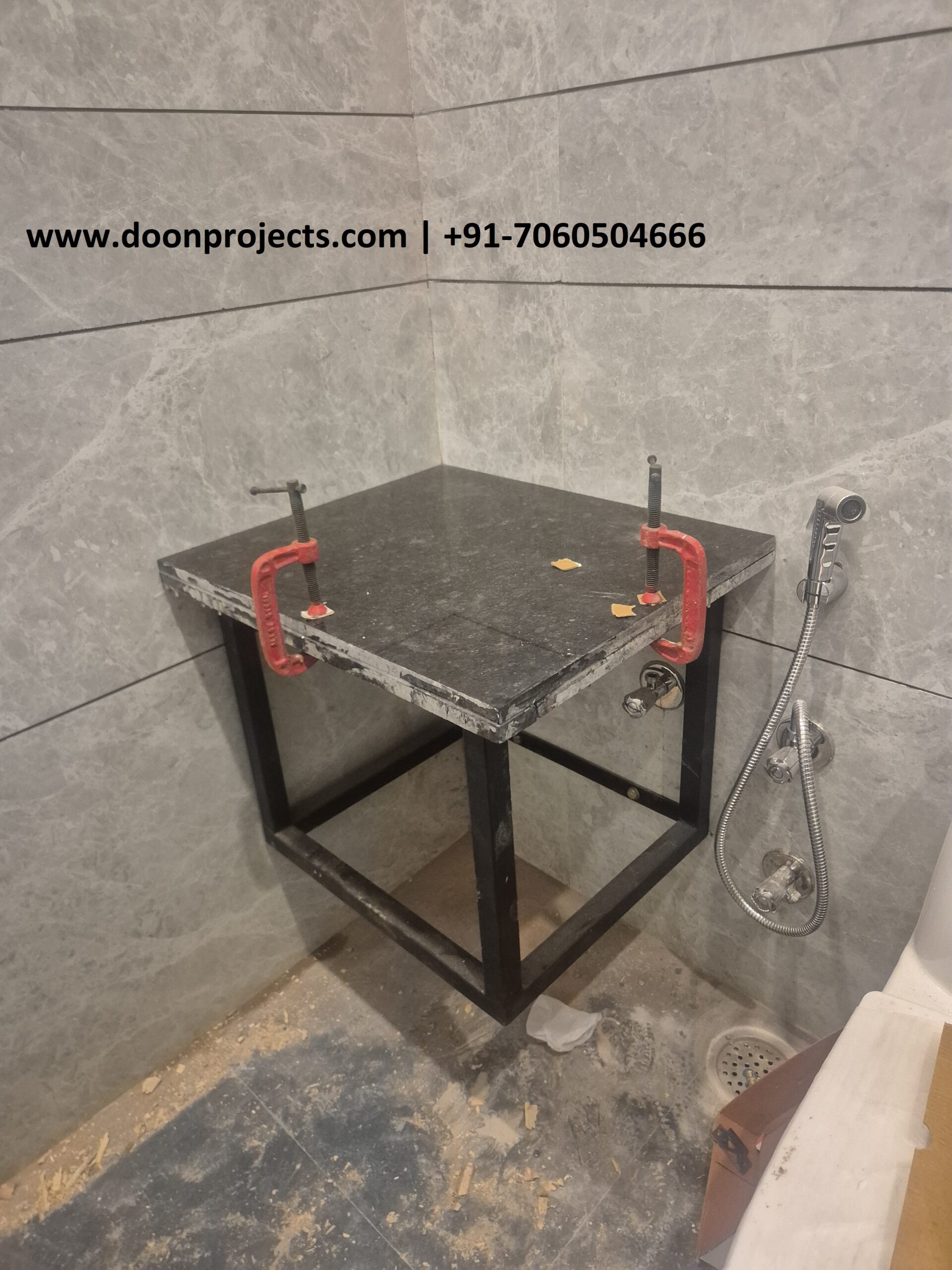MS Wall Hung Vanity Frame with Black Granite Top | Heavy Duty Bathroom Vanity Heavy-duty MS wall hung bathroom vanity frame with black granite top installed in a modern tiled bathroom.