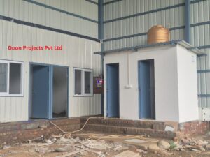Prefabricated staff toilet and bathroom pods with plumbing connections and water tank installation