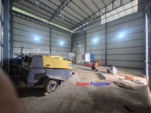 Covered storage warehouse featuring steel structure, halogen lighting, metal sheet roofing and a 15×15 ft sliding gate.